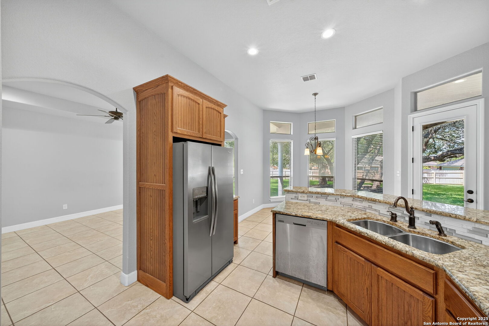 1626 Clover Ridge Pleasanton, TX 78064 - Photo 10 of 33 a kitchen with stainless steel appliances granite countertop a refrigerator and a sink