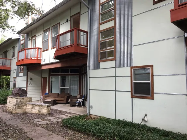 a view of a building with sitting area