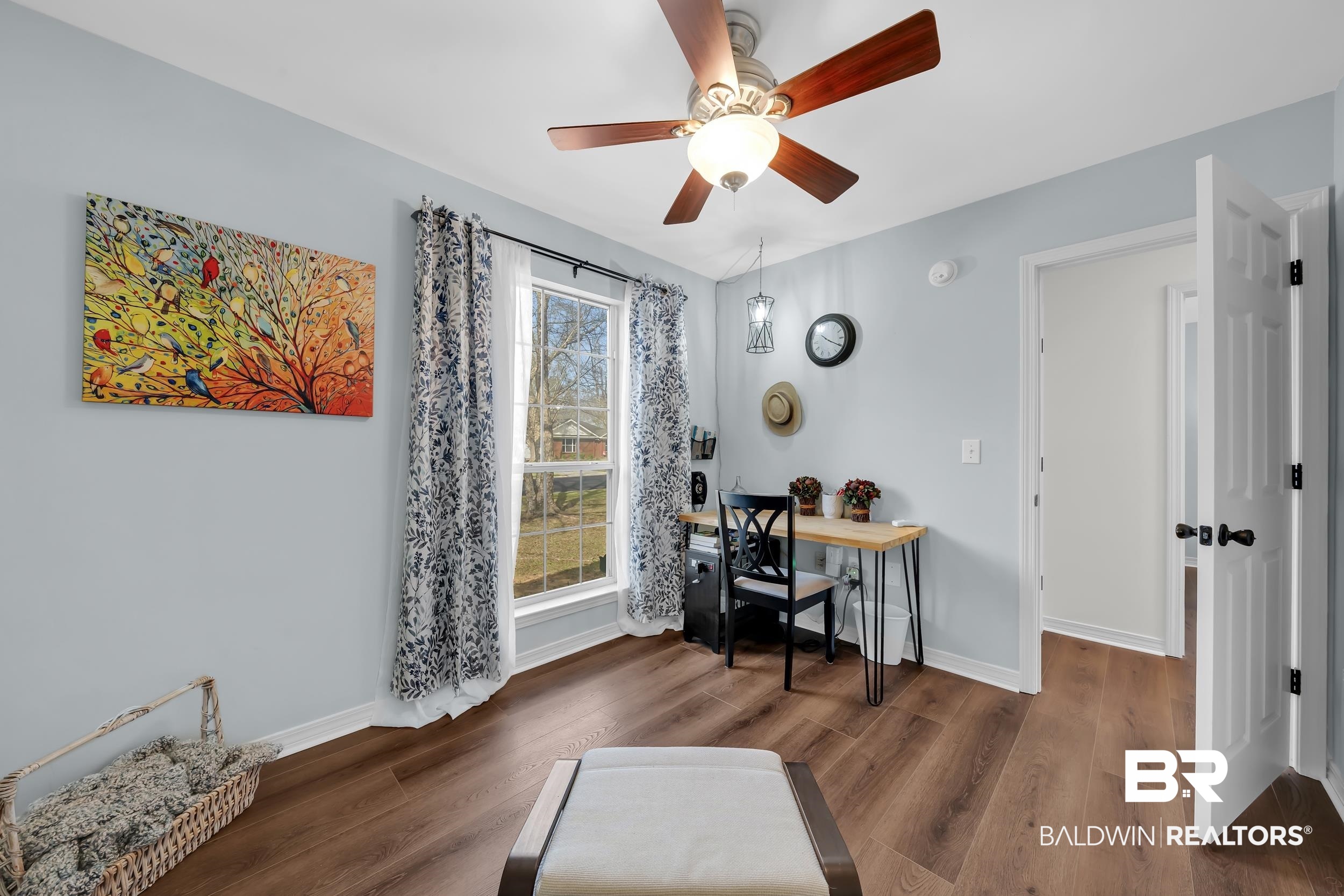 191 Robbins Boulevard Daphne, AL 36526 - Photo 16 of 24 Office area with dark wood-style floors and ceiling fan