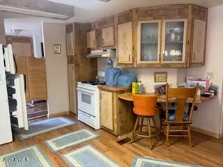 a view of a kitchen and dining room
