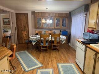 17230 Iron Springs Road Munds Park, AZ 86017 - Photo 20 of 42 a view of a dining room with furniture window and wooden floor