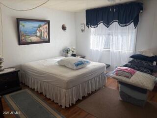 17230 Iron Springs Road Munds Park, AZ 86017 - Photo 25 of 42 a bedroom with double bed and a window