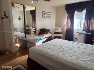 17230 Iron Springs Road Munds Park, AZ 86017 - Photo 28 of 42 a bedroom with a bed and a large mirror with a bathroom