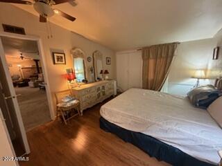 17230 Iron Springs Road Munds Park, AZ 86017 - Photo 36 of 42 a bedroom with a bed and wooden floor