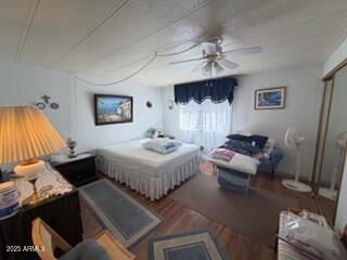 17230 Iron Springs Road Munds Park, AZ 86017 - Photo 38 of 42 a spacious bedroom with a bed and a couch