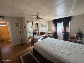 17230 Iron Springs Road Munds Park, AZ 86017 - Photo 39 of 42 a bed room with a bed window and a chair
