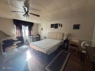 a bedroom with bed and window