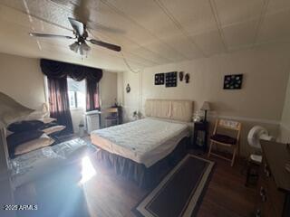17230 Iron Springs Road Munds Park, AZ 86017 - Photo 41 of 42 a bedroom with a bed a desk and chair