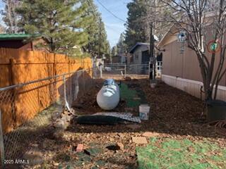 17230 Iron Springs Road Munds Park, AZ 86017 - Photo 5 of 42 a wooden bench sitting in a yard