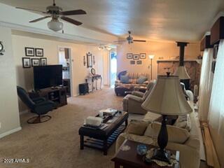 17230 Iron Springs Road Munds Park, AZ 86017 - Photo 9 of 42 a living room with furniture and a flat screen tv