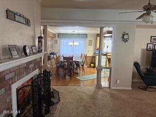17230 Iron Springs Road Munds Park, AZ 86017 - Photo 10 of 42 a living room with furniture a flat screen tv and white walls