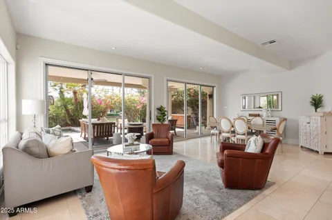 a living room with fireplace furniture and a flat screen tv
