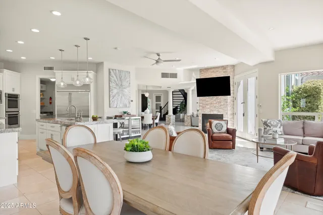 a large kitchen with stainless steel appliances granite countertop a sink stove and cabinets