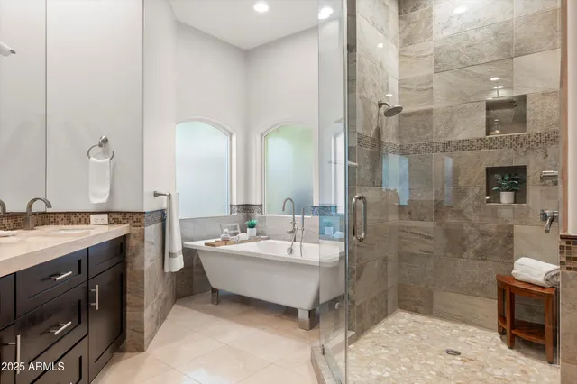 a bedroom with a large bed and a large window