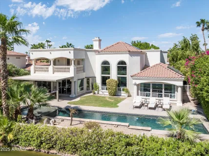 a front view of a house with garden and porch