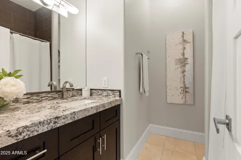 a view of a house with backyard and porch