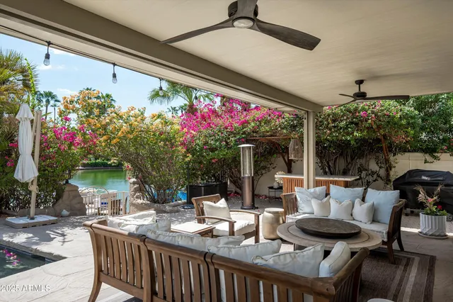 a view of a house with sitting area and garden