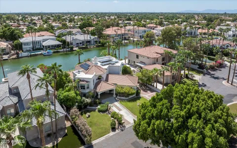 an aerial view of a house with a lake view