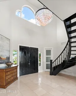 a living room with fireplace furniture and a flat screen tv