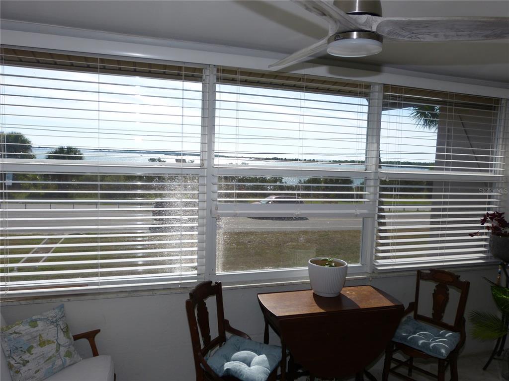 2 Causeway Boulevard, Unit 206 Dunedin, FL 34698 - Photo 15 of 26 a living room with furniture and a window