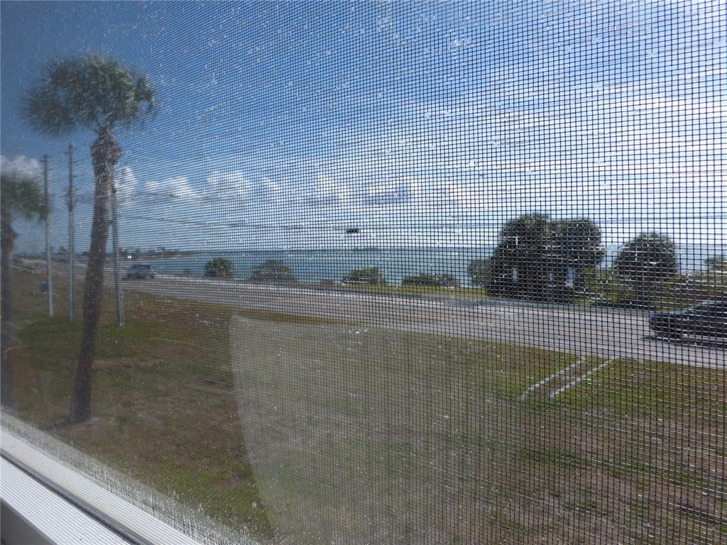 2 Causeway Boulevard, Unit 206 Dunedin, FL 34698 - Photo 23 of 26 a bathroom with a shower