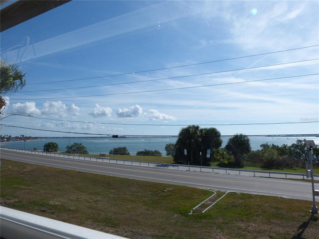 2 Causeway Boulevard, Unit 206 Dunedin, FL 34698 - Photo 25 of 26 a view of a lake from a building