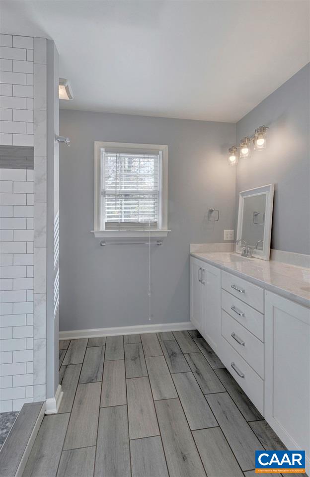 687 Poplar Spring Road Scottsville, VA 24590 - Photo 19 of 31 a bathroom with a sink and a mirror