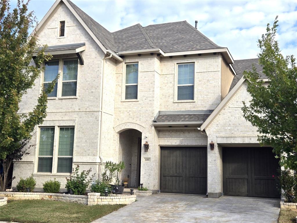 680 Wingate Road Coppell, TX 75019 - Photo 1 of 23 a front view of a house with a yard