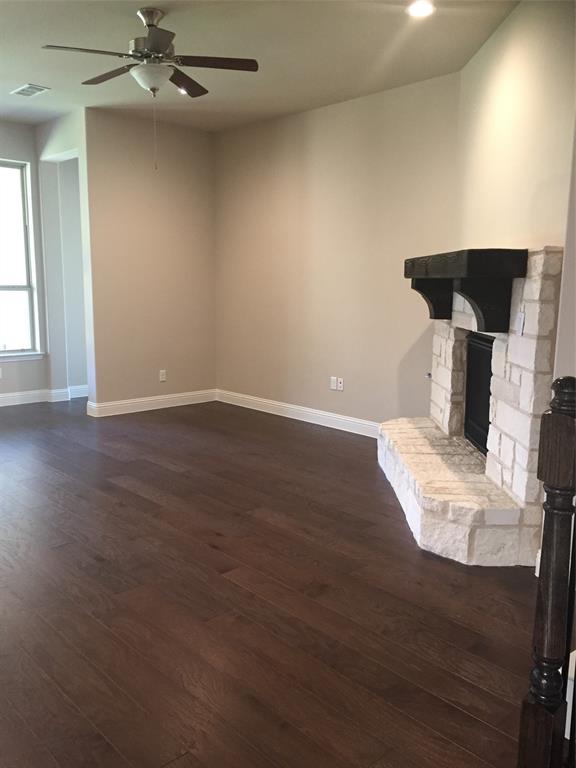 680 Wingate Road Coppell, TX 75019 - Photo 15 of 23 an empty room with wooden floor fan and windows