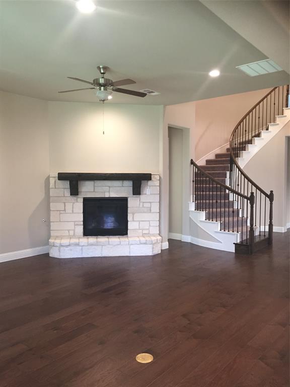 680 Wingate Road Coppell, TX 75019 - Photo 16 of 23 a view of empty room with wooden floor and fireplace