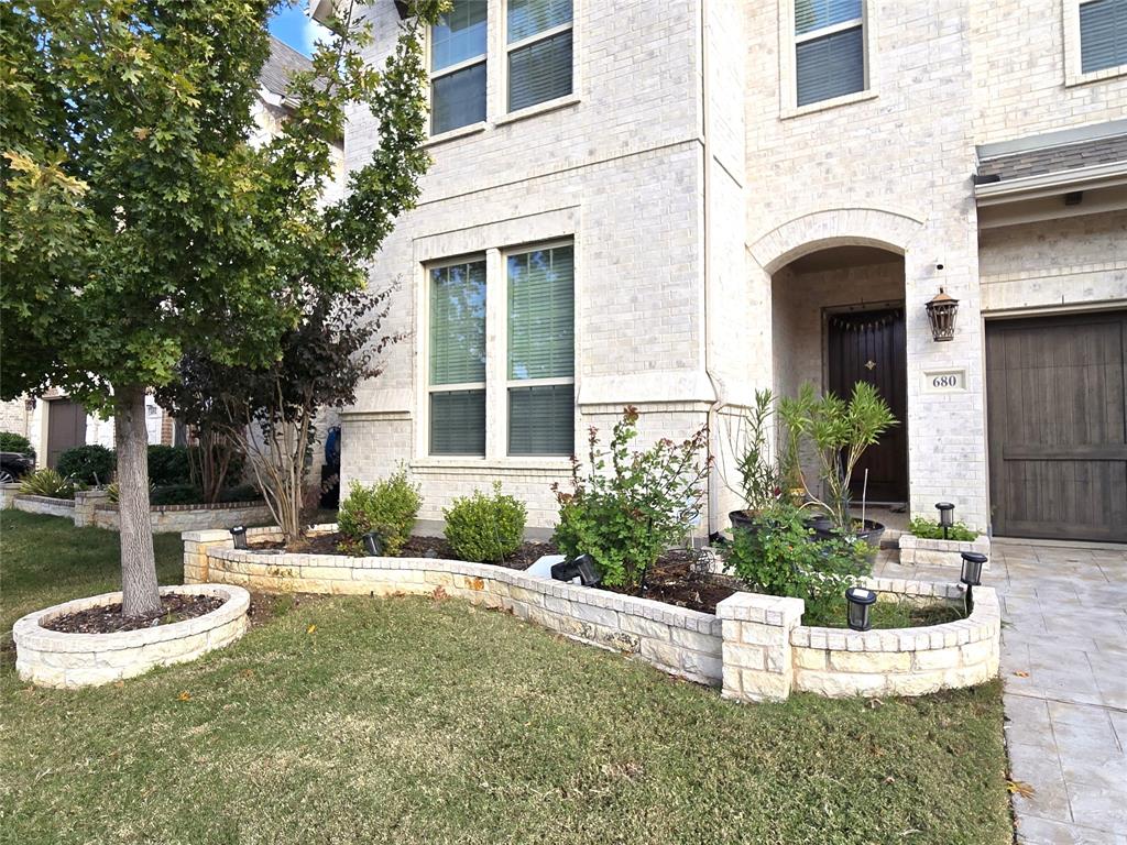 680 Wingate Road Coppell, TX 75019 - Photo 2 of 23 a view of a house with fountain and a fountain