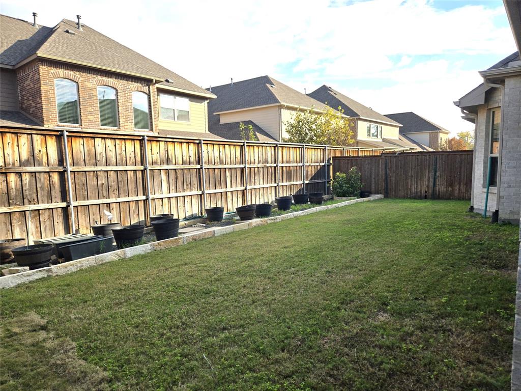 680 Wingate Road Coppell, TX 75019 - Photo 21 of 23 a view of a house with a yard and sitting area
