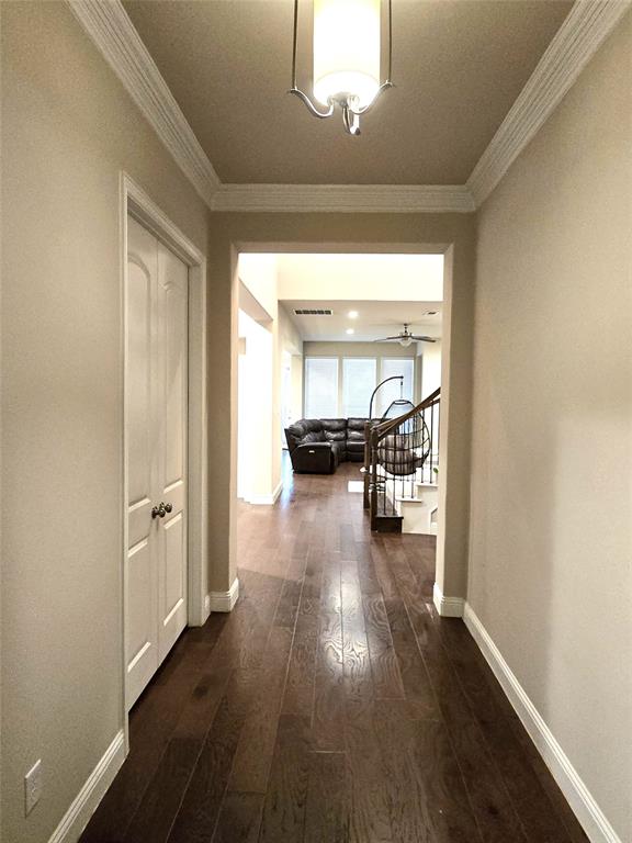 680 Wingate Road Coppell, TX 75019 - Photo 3 of 23 a hallway with wooden floor and furniture