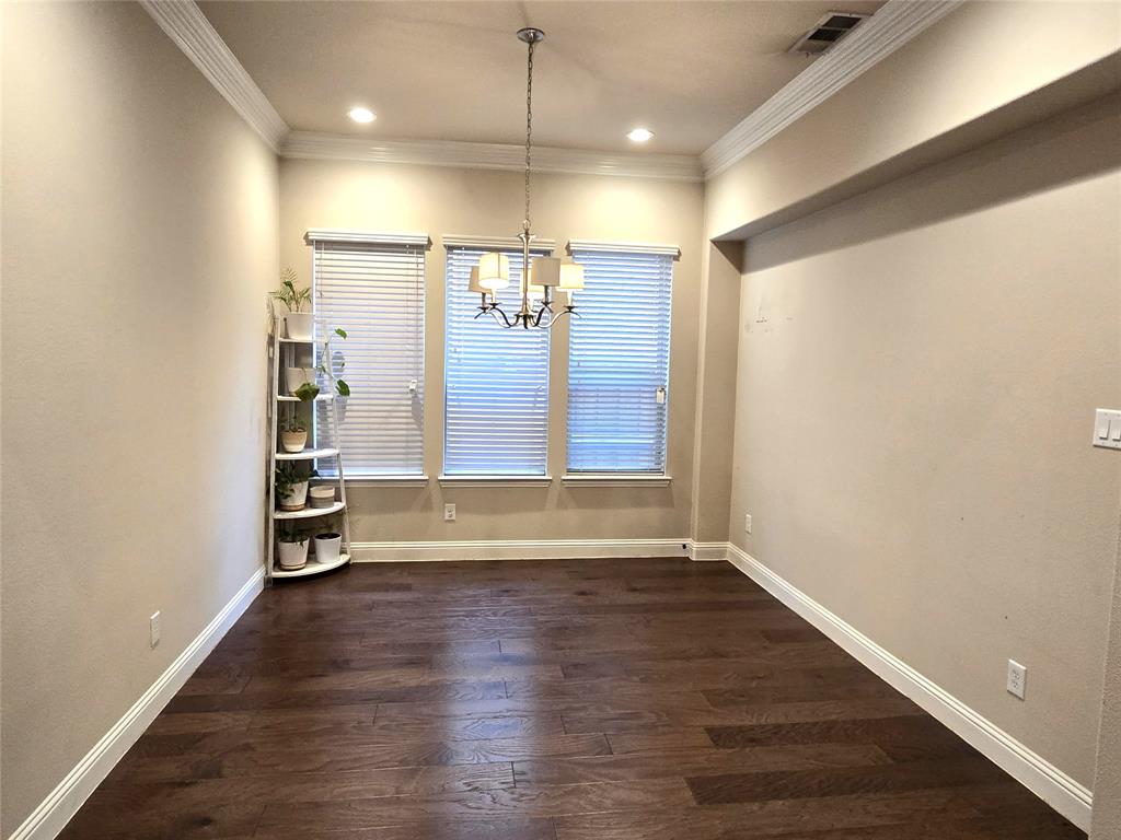 680 Wingate Road Coppell, TX 75019 - Photo 7 of 23 an empty room with wooden floor and windows