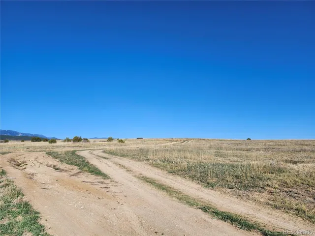 a view of ocean beach and a mountain