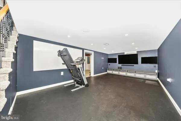 a view of an empty room with stairs