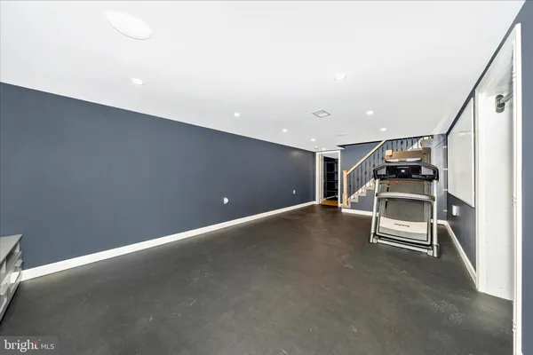 a view of an empty room with stairs and ventilation