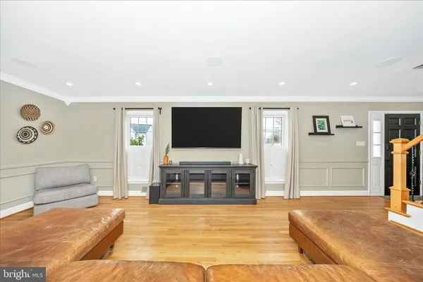 a living room with a flat screen tv and a couch