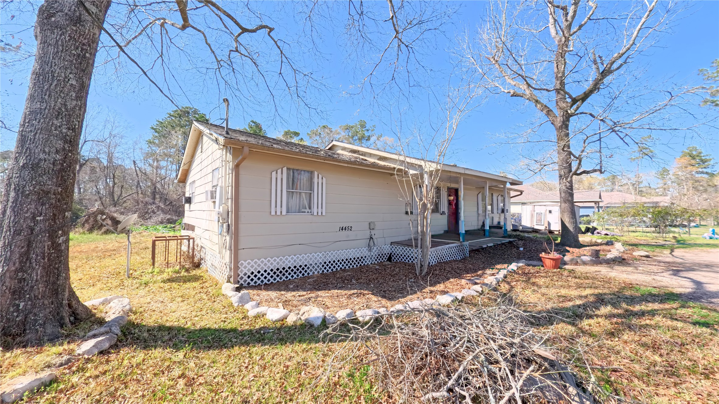 14452 Half Circle Splendora, TX 77372 - Photo 2 of 13 a view of a house with a patio