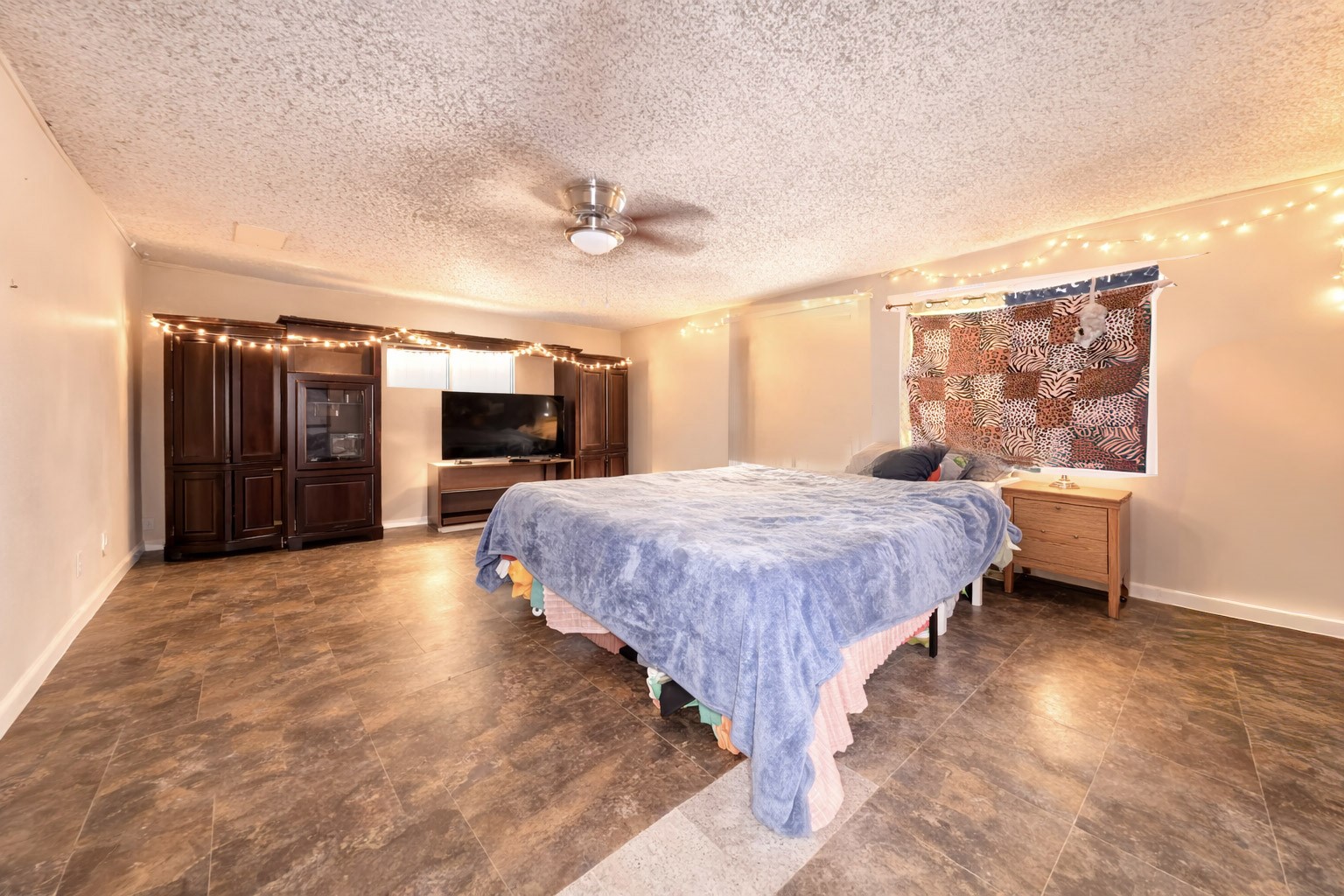 14452 Half Circle Splendora, TX 77372 - Photo 7 of 13 a spacious bedroom with a bed and a flat screen tv