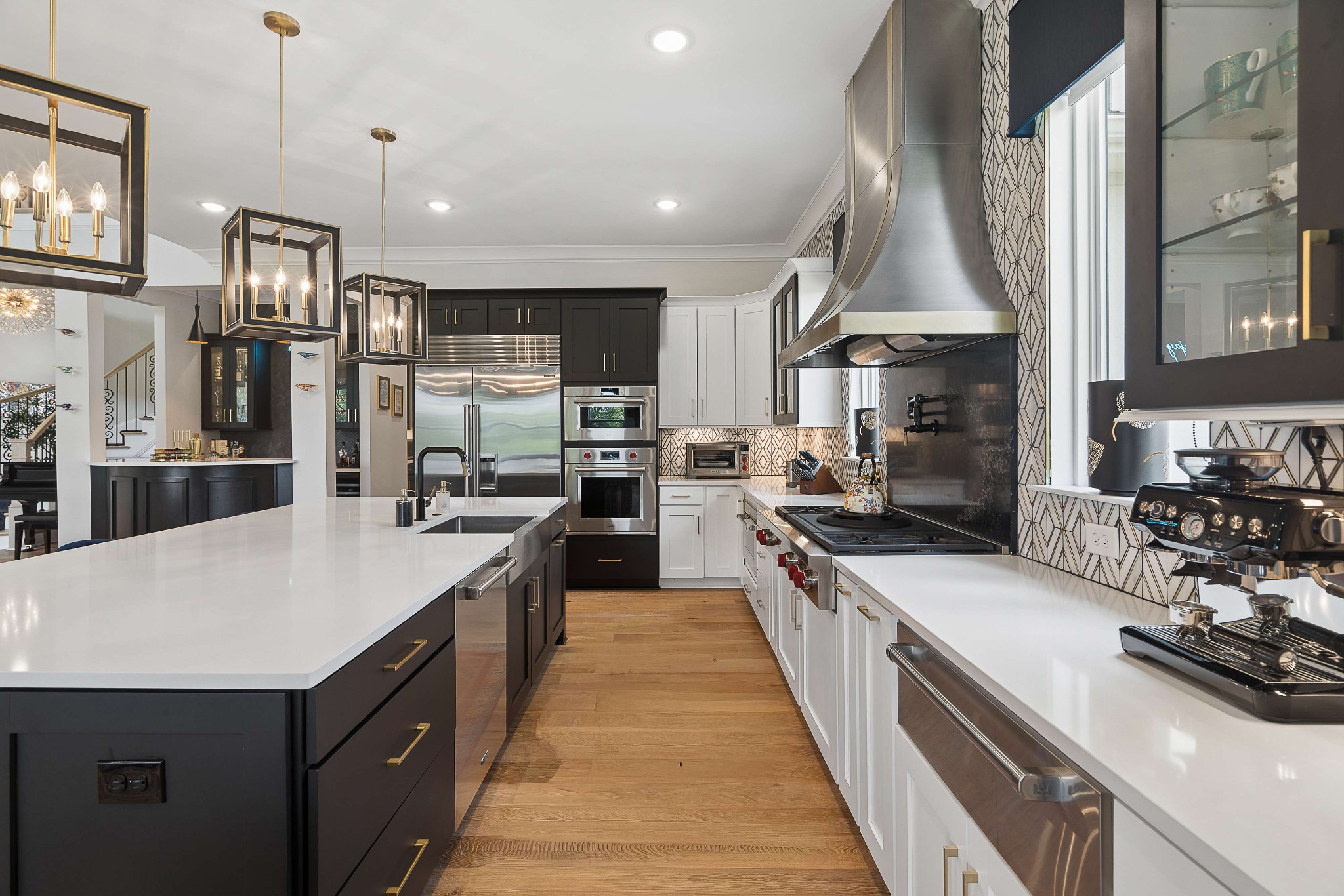 6004 Lookaway Circle Franklin, TN 37067 - Photo 21 of 71 a large kitchen with stainless steel appliances a large counter top a stove a chimney a sink and a large window