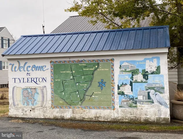 an aerial view of a house with a ocean view