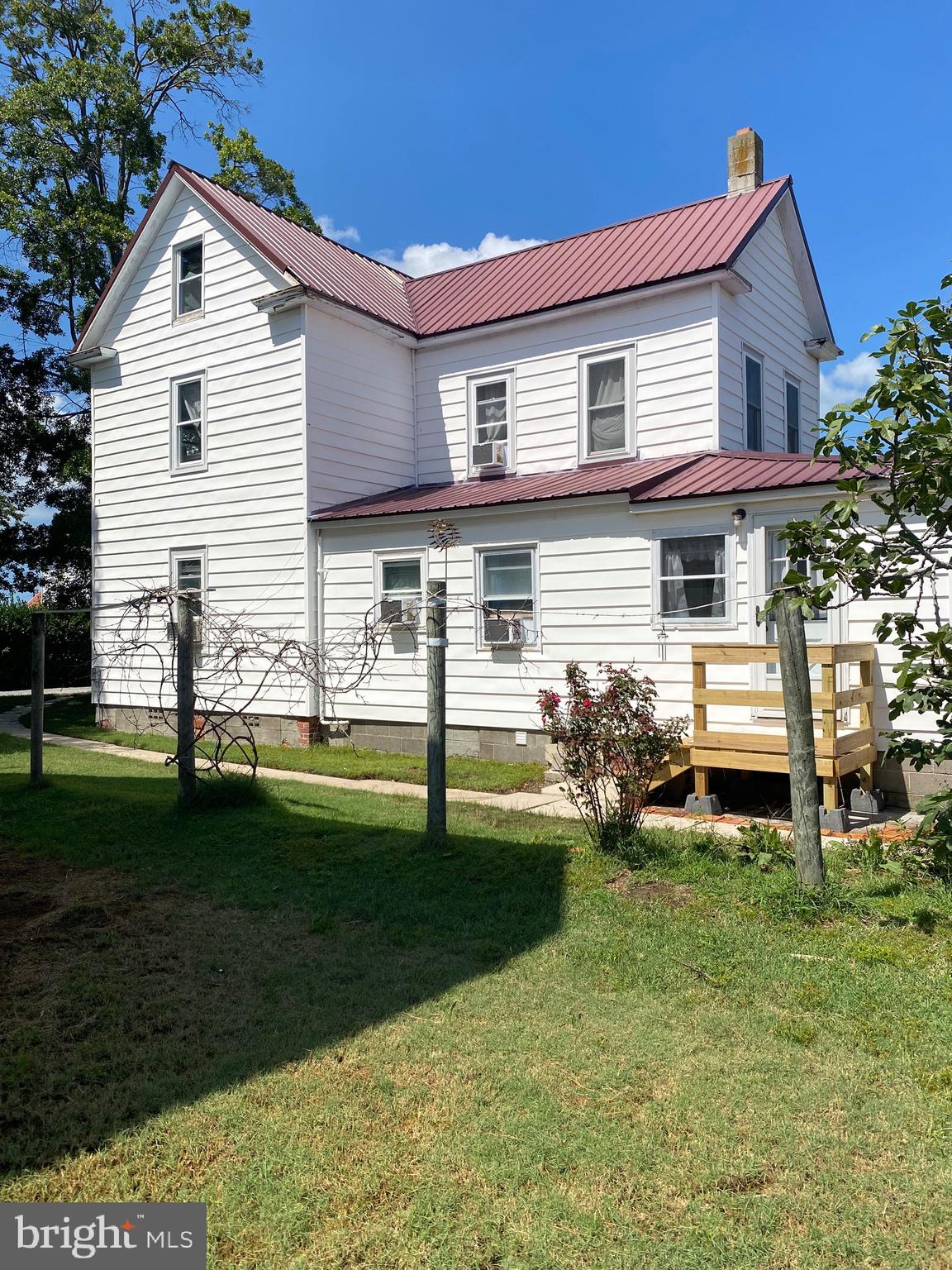 3035 Union Church Road Tylerton, MD 21866 - Photo 5 of 31 a front view of a house with a yard