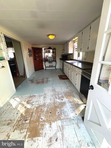 a view of a kitchen with a sink