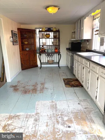 a view of kitchen with furniture and window