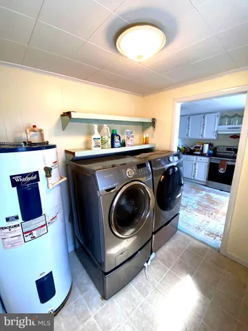 a kitchen with a stove a refrigerator and a sink