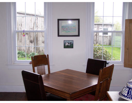 235 Lions Mouth Road Amesbury, MA 01913 - Photo 11 of 12 a view of a dining room with furniture window and outside view