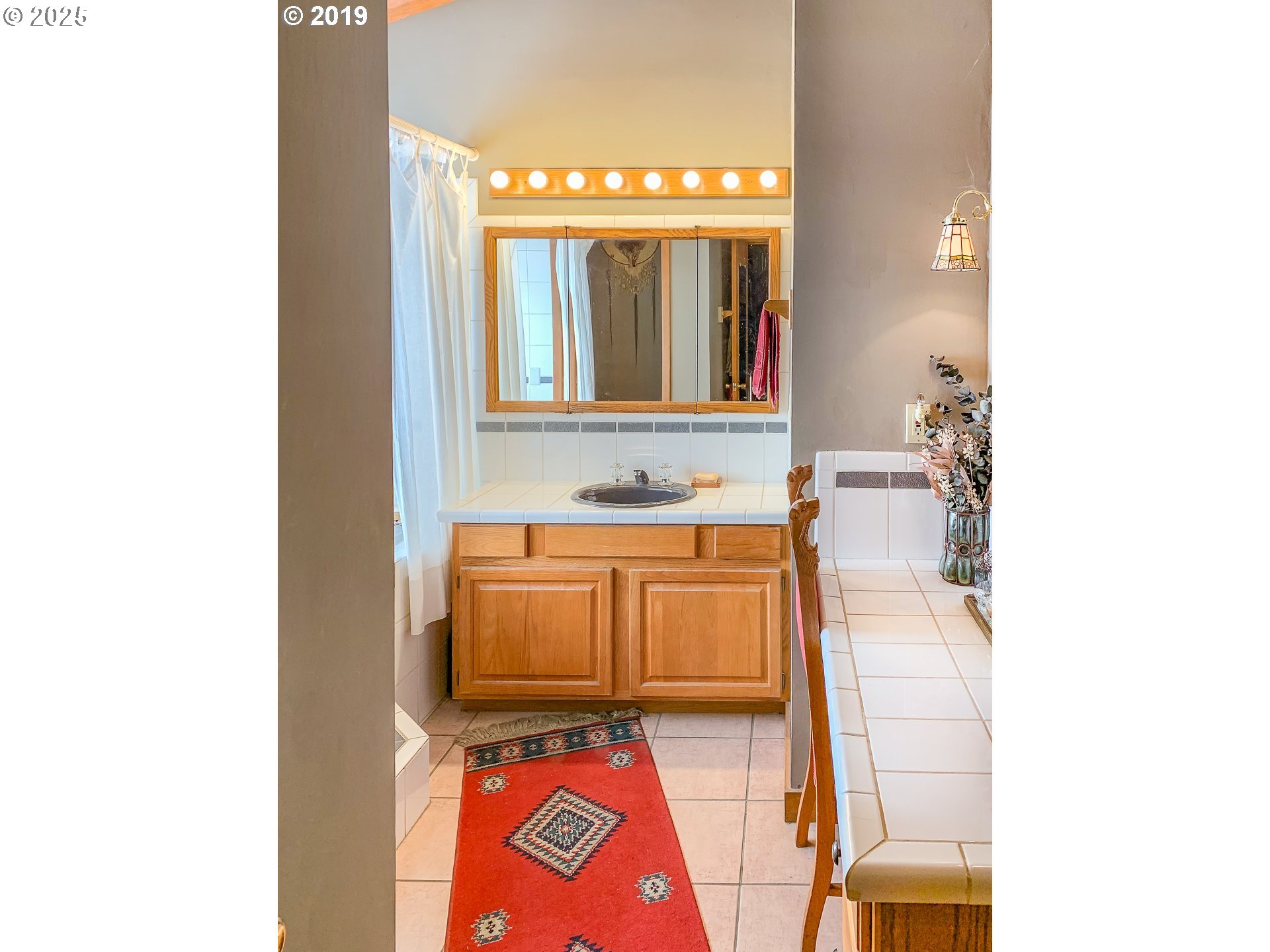1138 Yokum Road Riddle, OR 97469 - Photo 11 of 33 a bathroom with a sink and a mirror