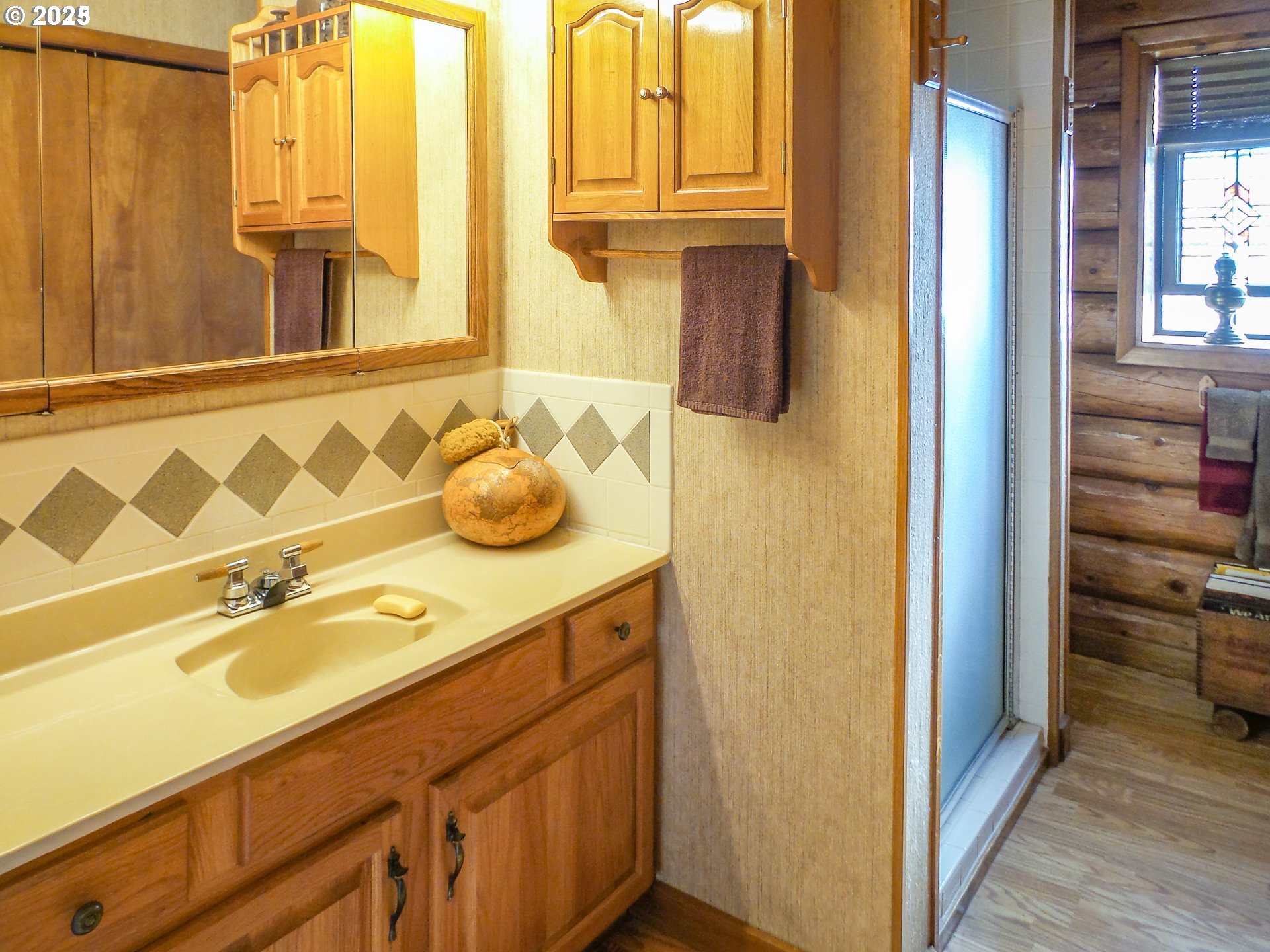 1138 Yokum Road Riddle, OR 97469 - Photo 12 of 33 a bathroom with a granite countertop sink and a mirror