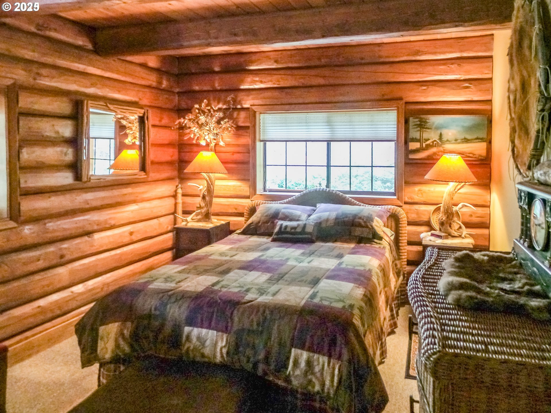 1138 Yokum Road Riddle, OR 97469 - Photo 14 of 33 a bed sitting in a bedroom next to a window